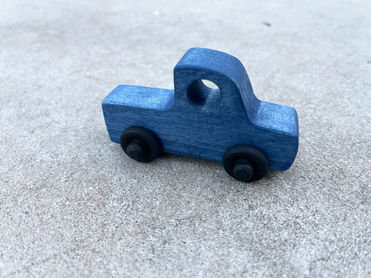 The LITTLE BLUE TRUCK maple wood nontoxic stained rolling mini truck