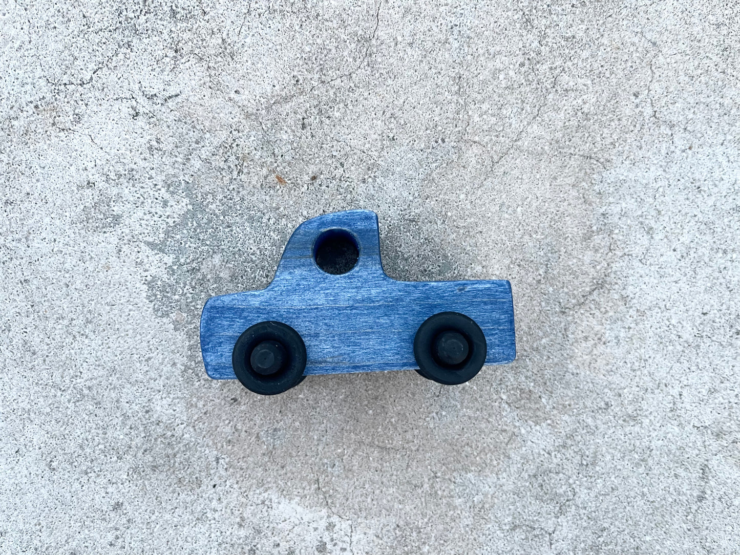 The LITTLE BLUE TRUCK maple wood nontoxic stained rolling mini truck