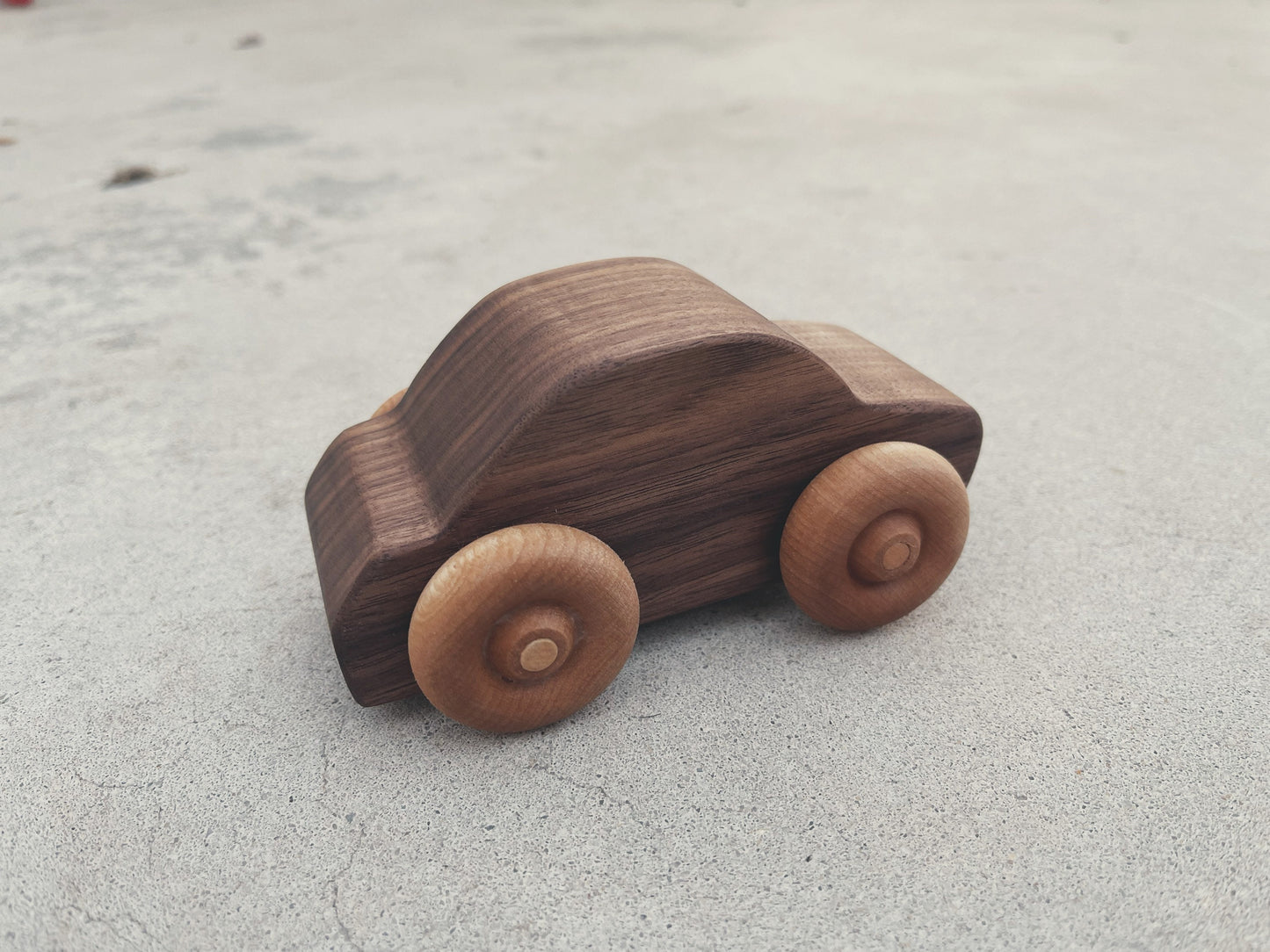 Handcrafted walnut wood rolling toy car