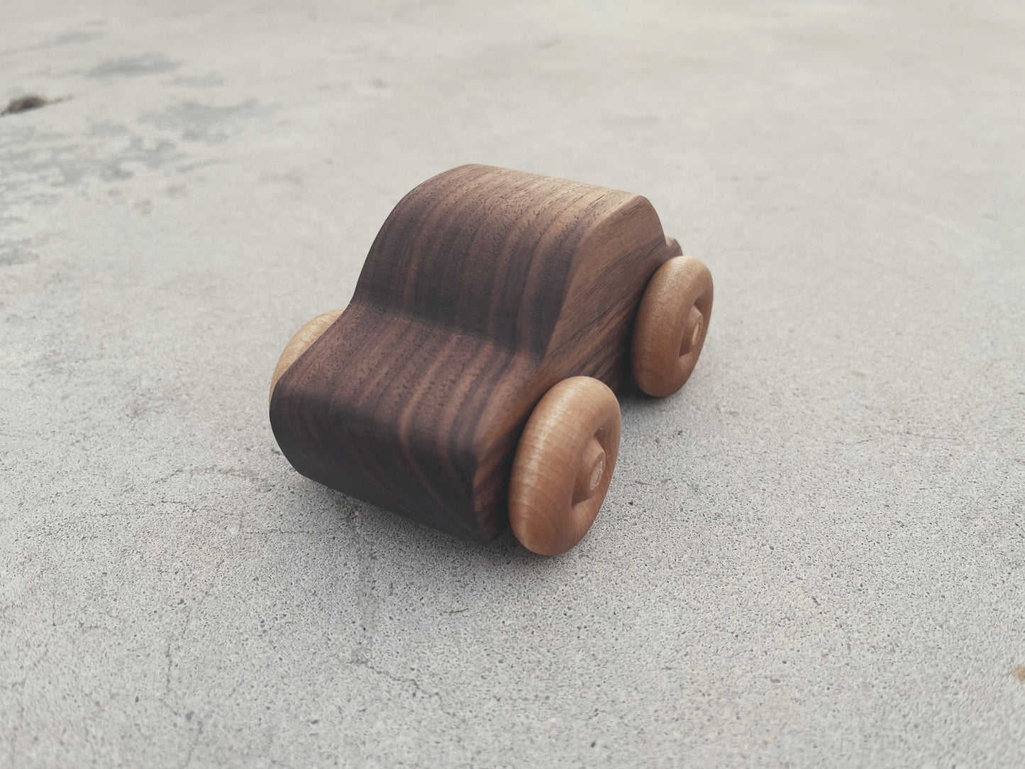 Handcrafted walnut wood rolling toy car