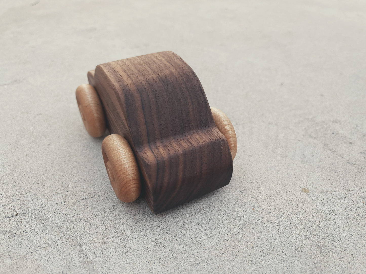 Handcrafted walnut wood rolling toy car