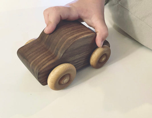 Handcrafted walnut wood rolling toy car