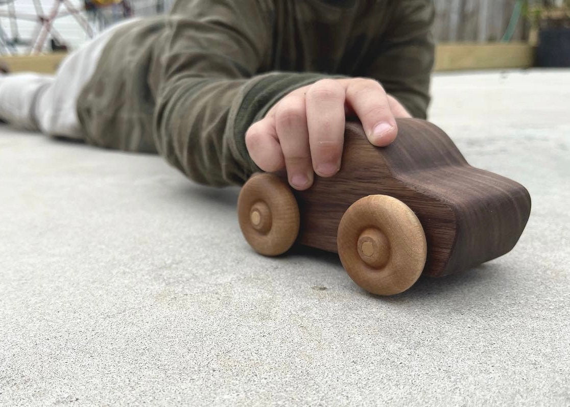 Handcrafted walnut wood rolling toy car